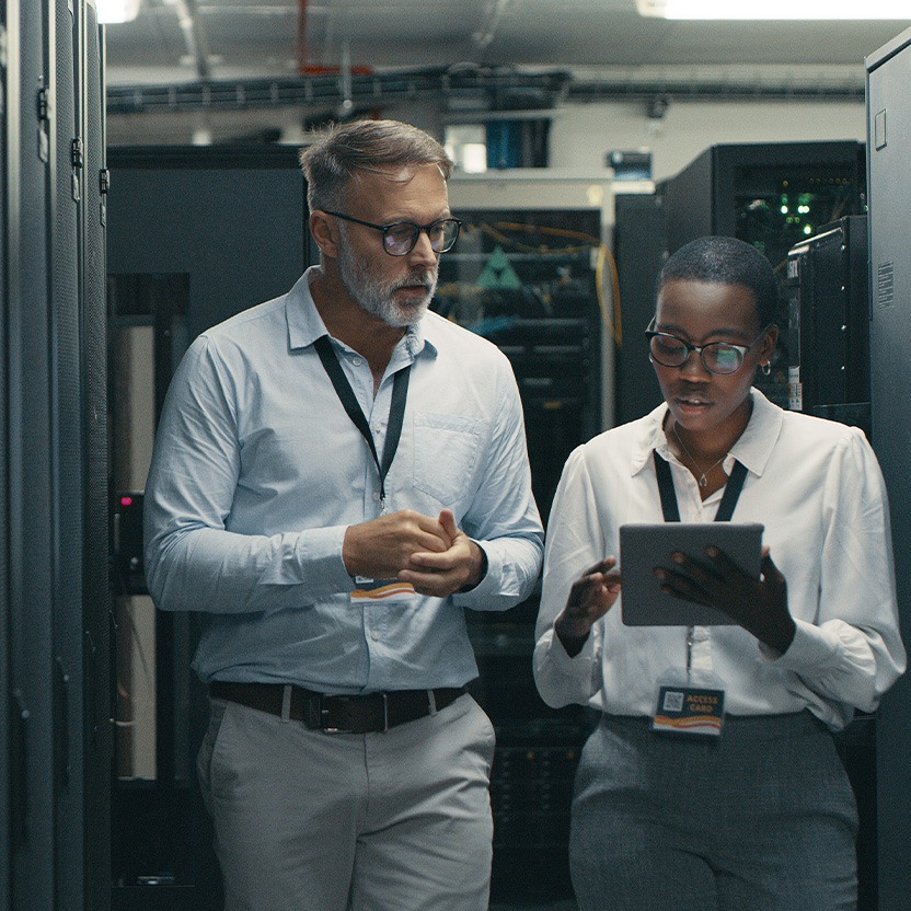 Two employees looking at a tablet