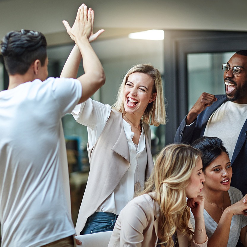 People in the office high-fiving